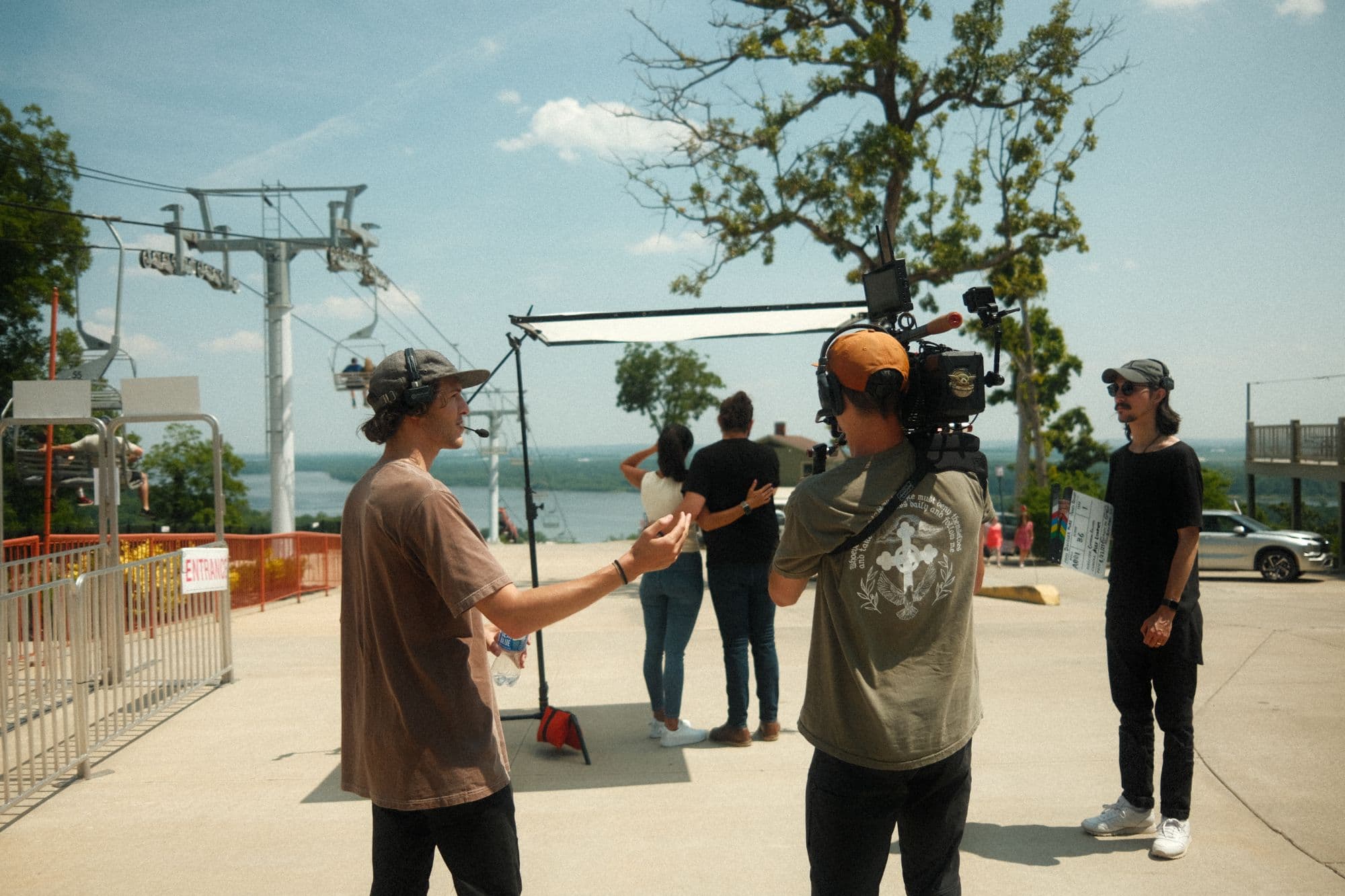 On set, directing at the chairlift